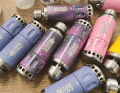 Cerakote painted quake impact grenades laid on a bench